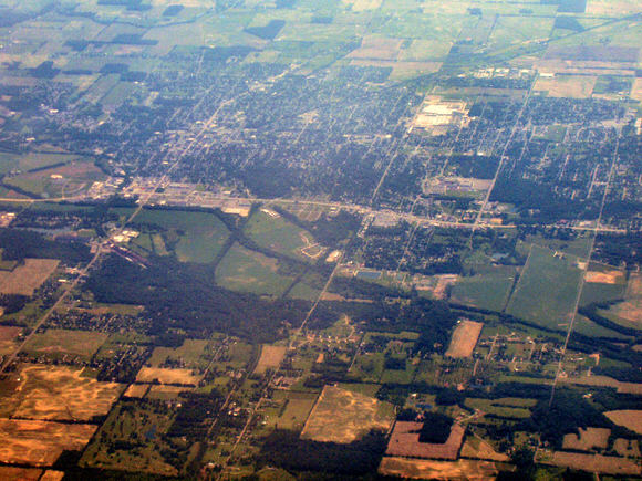 Aerial view of farmland and small settlement